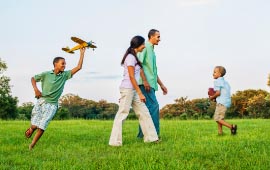 Family playing in a field