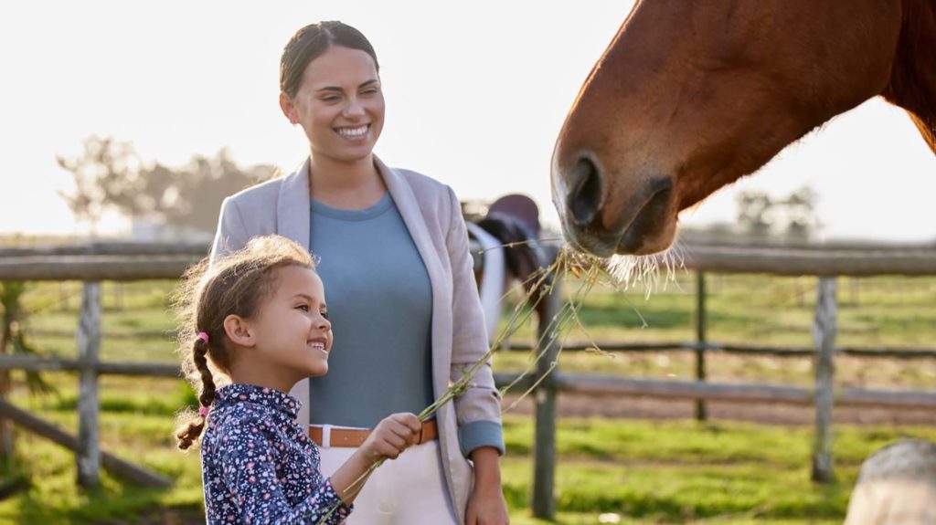 Mother and Daughter feeding horse | Farm Focus LifeStle