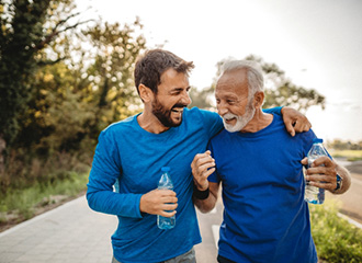 adult father and son walking